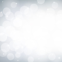 White and grey bokeh effect, Winter snowy background, Abstract blurred vector backdrop.