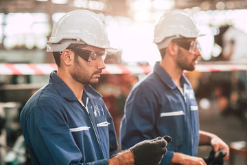 Head of engineer, worker leader portrait self confidence and professional look wearing safty glasses and white helmet.