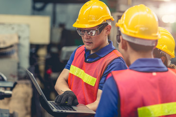 engineer team mix race working together in heavy industry with laptop computer discussion, join engineer teamwork.