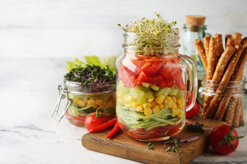 Vegan salad in with microgreens in a jar