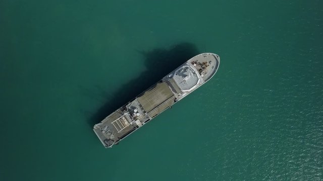 Drone scene - birds view and pull up over decommissioned Fishing Trauler - of the coast of Kho Samui Island in Thailand