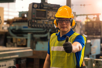 An engineer working in the the industrial. Asian portrait of a young engineer man wear a safety...