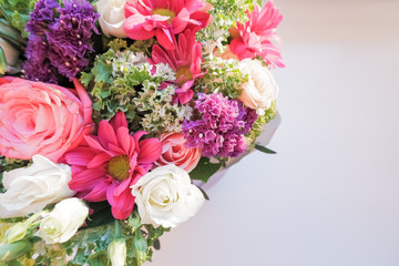Elegant bouquet of amaryllis, chrysanthemums and roses on a white background. A large bouquet of exotic flowers.Selective focus, blurred flowers.arrangement of fresh flowers.Copy space