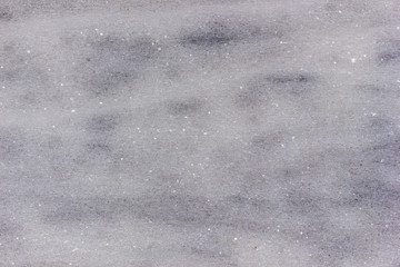 Scratched rough gray marble surface. Grain texture background.