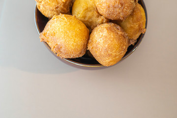 Bowl full of Nigerian buns ready to eat