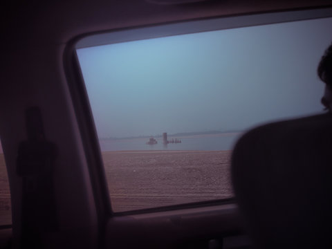 Ancient Temple submerged through a car window