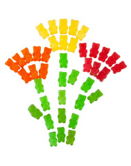 jelly bears on a white background are arranged in the form of flowers