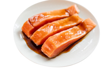 Raw salmon topped with sauce