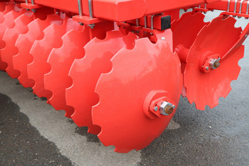 An image of a fragment of an agricultural machine. Plow. Harrow. Trailer.