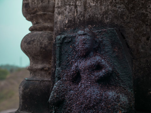 Ancient stature in the wall of an old temple