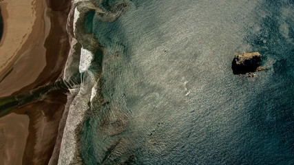 Beautiful aerial view of a sunset in  Naranjo Beach - Witch Rock Costa Rica