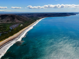 Beautiful aerial view of a sunset in  Naranjo Beach - Witch Rock Costa Rica