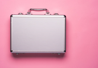 Contemporary aluminum briefcase on pink background. Flat lay concept. - obrazy, fototapety, plakaty