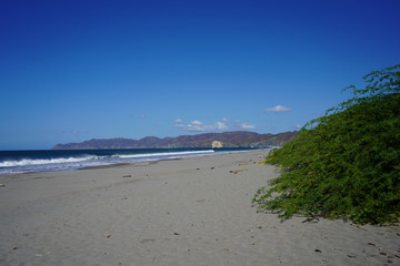 Beautiful aerial view of a sunset in  Naranjo Beach - Witch Rock Costa Rica