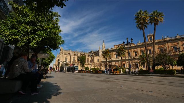 4K Timelapse of the busy Constitution Avenue with crowdsof people walking along and trams in Seville City Center..