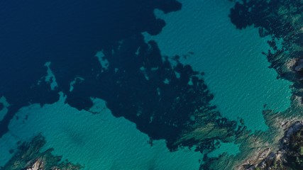 Fototapeta na wymiar Aerial view of Halkidiki lagoon, Vouvourou beach, turquoise water of Aegean sea, rocks underwater. Greece seascape.