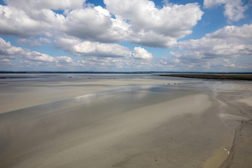 Low tide in the bay in front of Mont Saint Michel in Normandy, France.