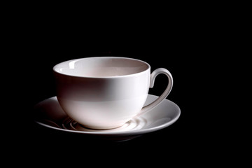 Preparation of aromatic morning coffee. Empty white coffee cup on a dark table