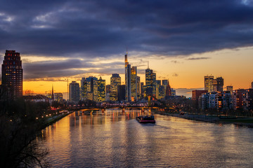 Fototapeta na wymiar Nice night shot from Frankfurt am Main in Germany. City view in the evening with city lights and illuminated skyline on the river main