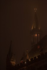 Fototapeta na wymiar glowing cathedral towers at night with mist