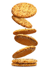 Falling oatmeal cookies, isolated on white background