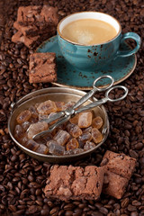 Composition with coffee mug,  vanilla  cookies and coffee beans on dark background