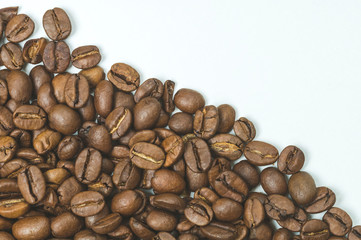roasted coffee beans on a white background top view,