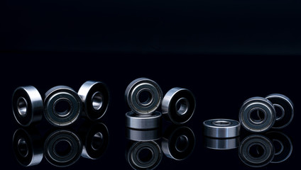 Stainless steel ball bearing on balck backgroud. Set of thrust ball bearing and silver ball...