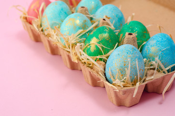 Easter background. Tender pink Easter decoration, painted Easter eggs. Copy space, Ester holiday postcard concept.