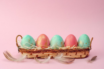 Easter background. Tender pink Easter decoration, painted Easter eggs. Copy space, Ester holiday postcard concept.