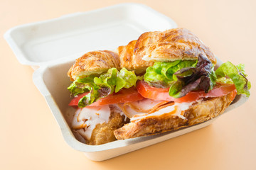 Sandwich of croissant of lettuce, tomato and smoked turkey