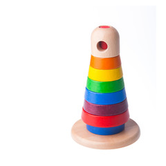 Toy or baby toy wood color pyramid on background new.