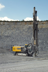 Drilling machine standing in the quarry, close-up.