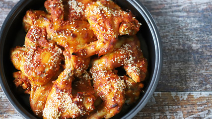 Baked chicken wings in a pan. Keto Paleo. Pegan diet.