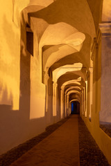 Archway in old town of Imperia in the night, Liguria region, Italy