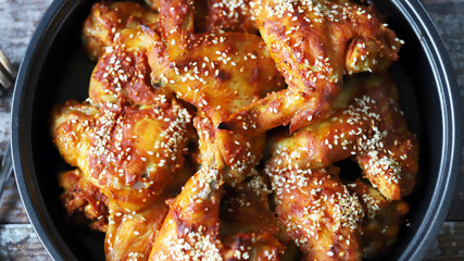 Baked chicken wings in a pan. Keto Paleo. Pegan diet.