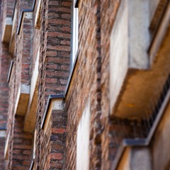 apartment windows on side of brick building