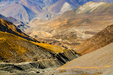 Kali Gandaki river valley with old Jhong (Dzong) village in sunny day. View from trekking route...