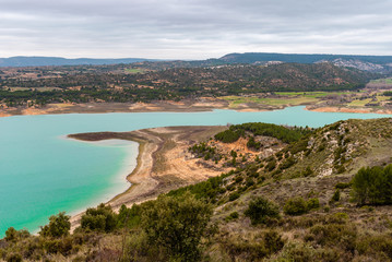 Fototapeta na wymiar Buendia reservoir with turquoise waters in spring. La Alcarria region, Spain