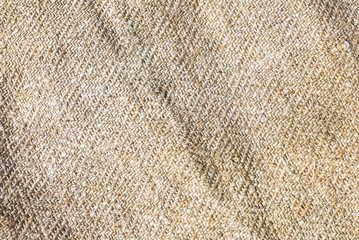 Old rustic linen tablecloth napkin. Natural vintage background texture.