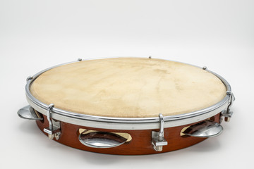 A pandeiro in front of white background