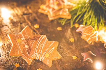 Homemade christmass cookies. Star shaped gingerbread cookies on a wooden background. Star...