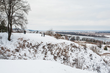 Winter monochrome landscape: white snow field and river