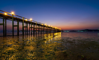 Wooden bridge of Chan Damri Beach at sunset ,Ranong ,Thailand