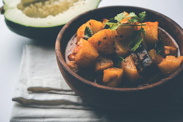 Kaccha Papita Sabji or Raw Papaya Sabzi, served in a karahi or bowl. selective focus