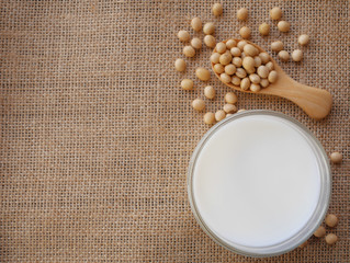 soy milk and soybean on sack background