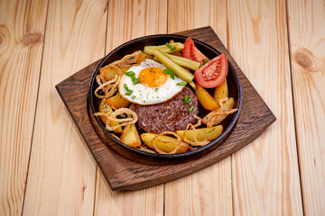 baked potato with cutlet and vegetables