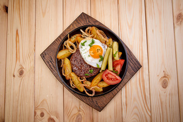 baked potato with cutlet and vegetables