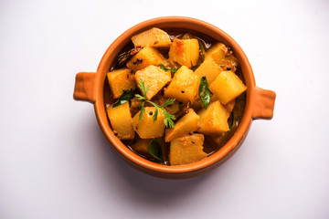 Kacha Papita sabzi with gravy or Raw Papaya curry Sabji , served in a bowl. selective focus