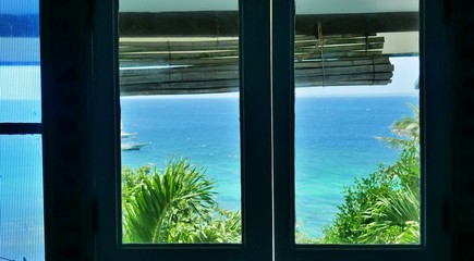 heavenly view through the balcony door at Apo Island, Philippines